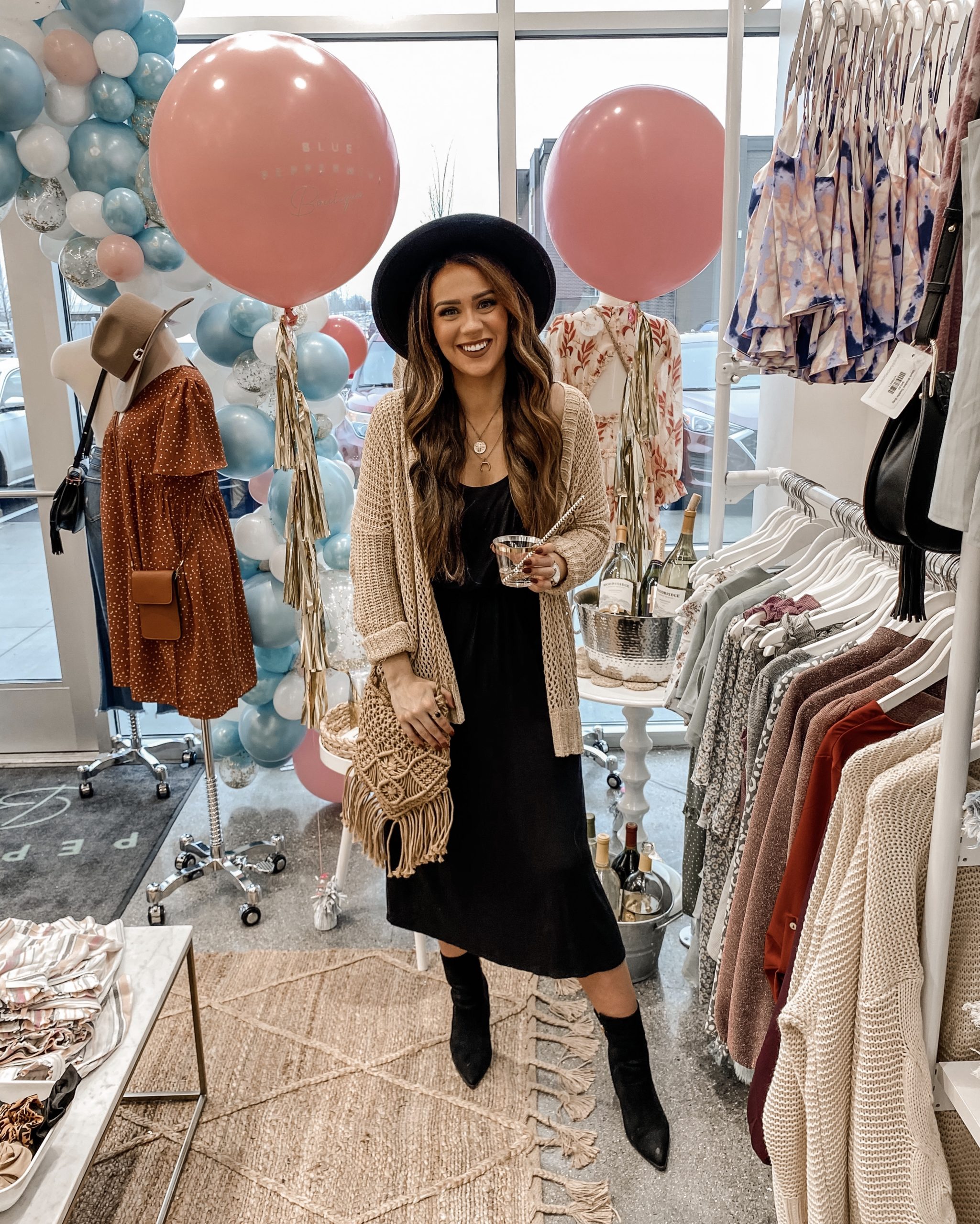 a woman smiling standing inside of a store