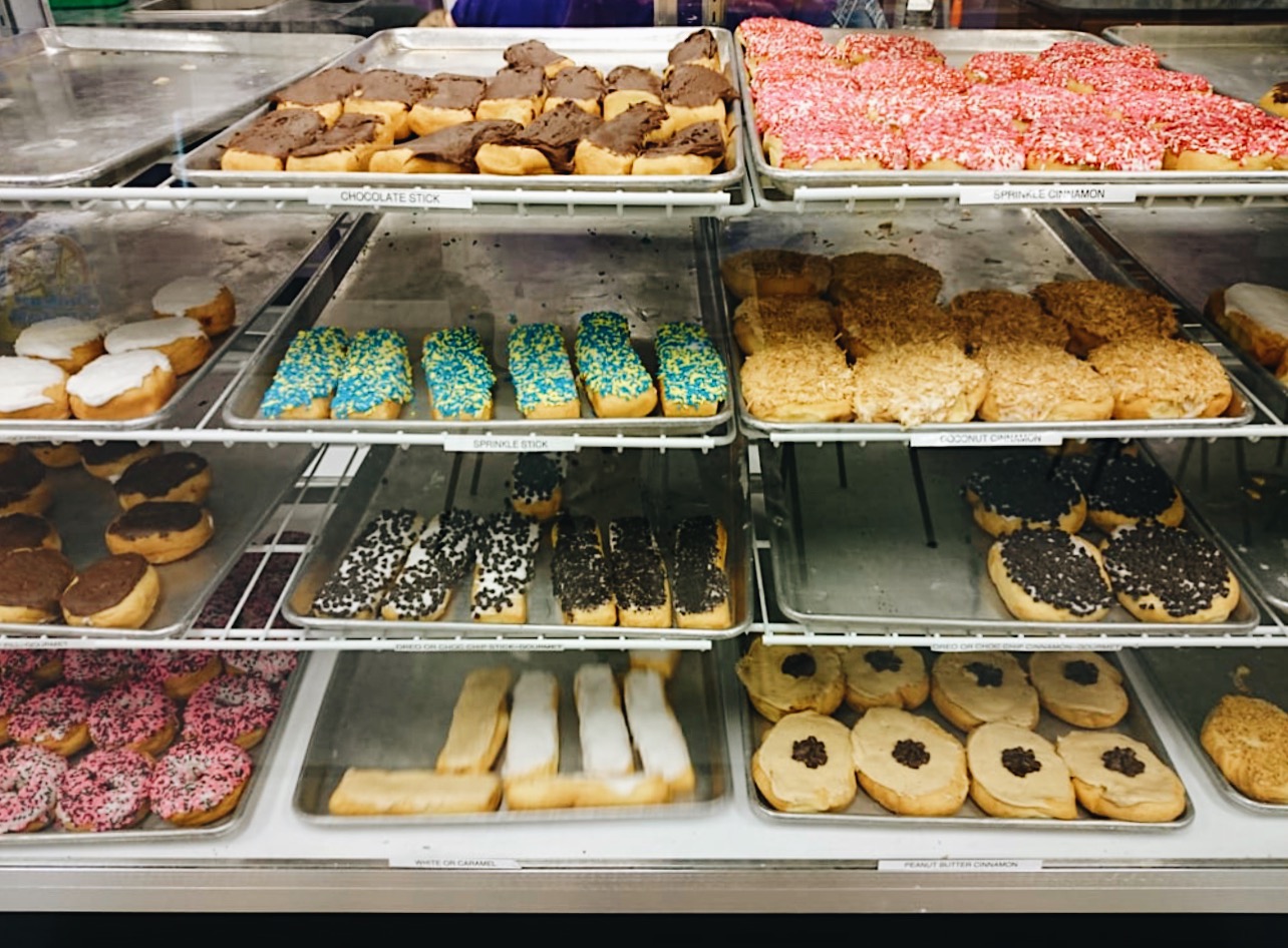 a display case of assorted donuts