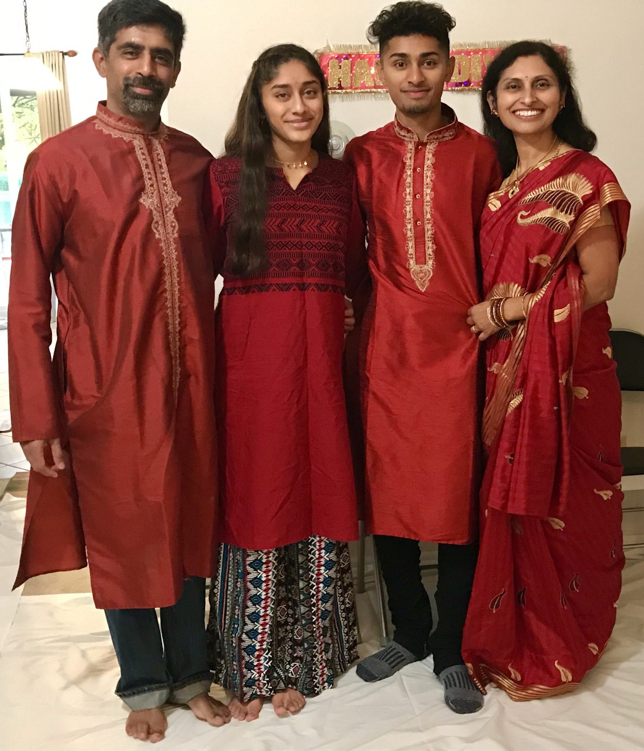a family standing together and smiling