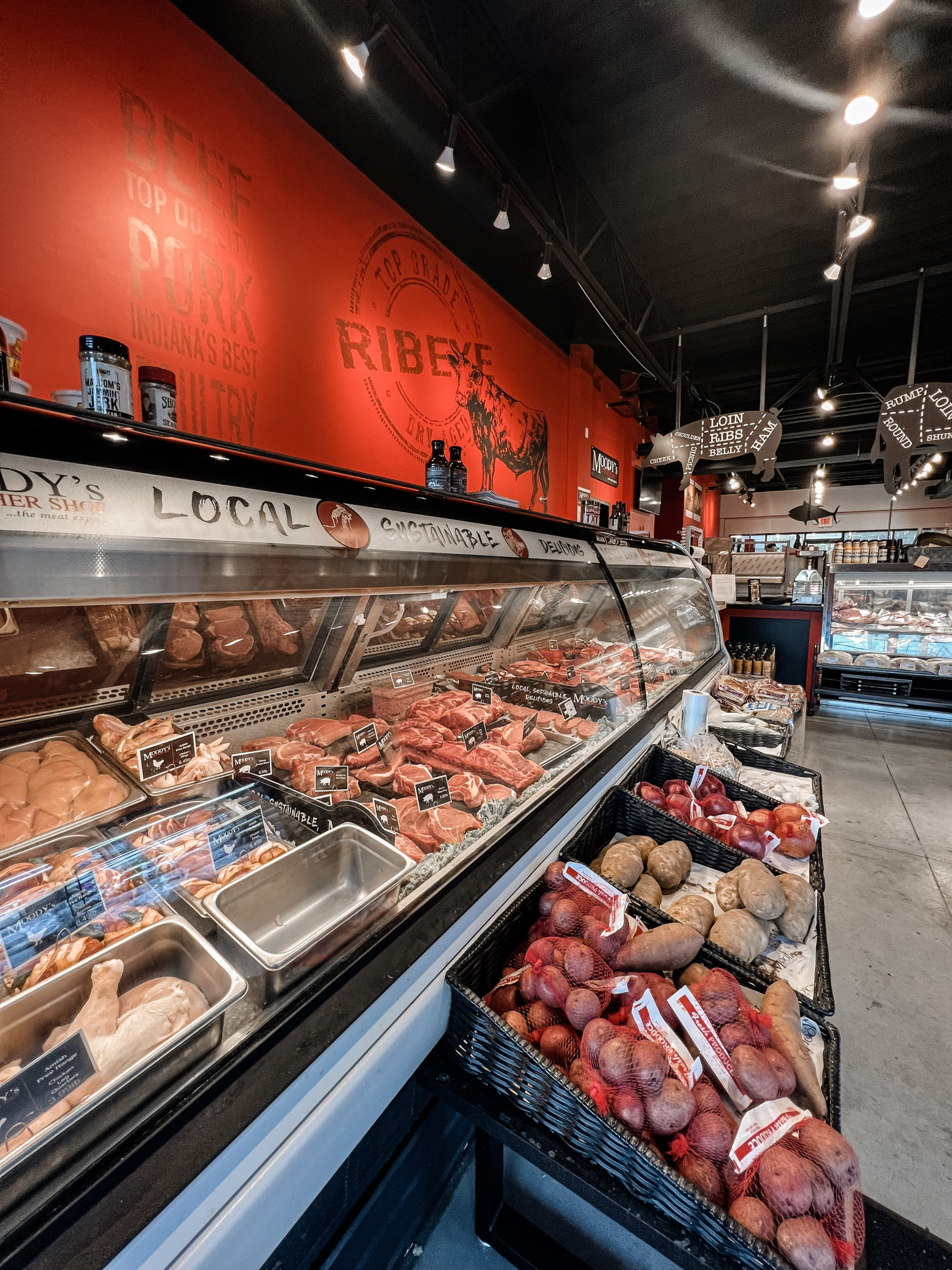 an overview of a meat section in a store