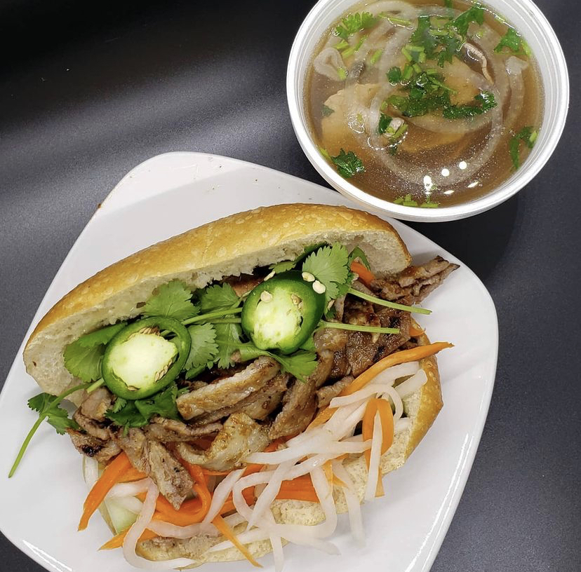a sandwich with a side of pho