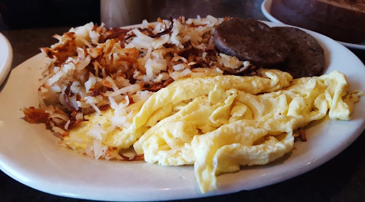 a plate with eggs and hashbrowns