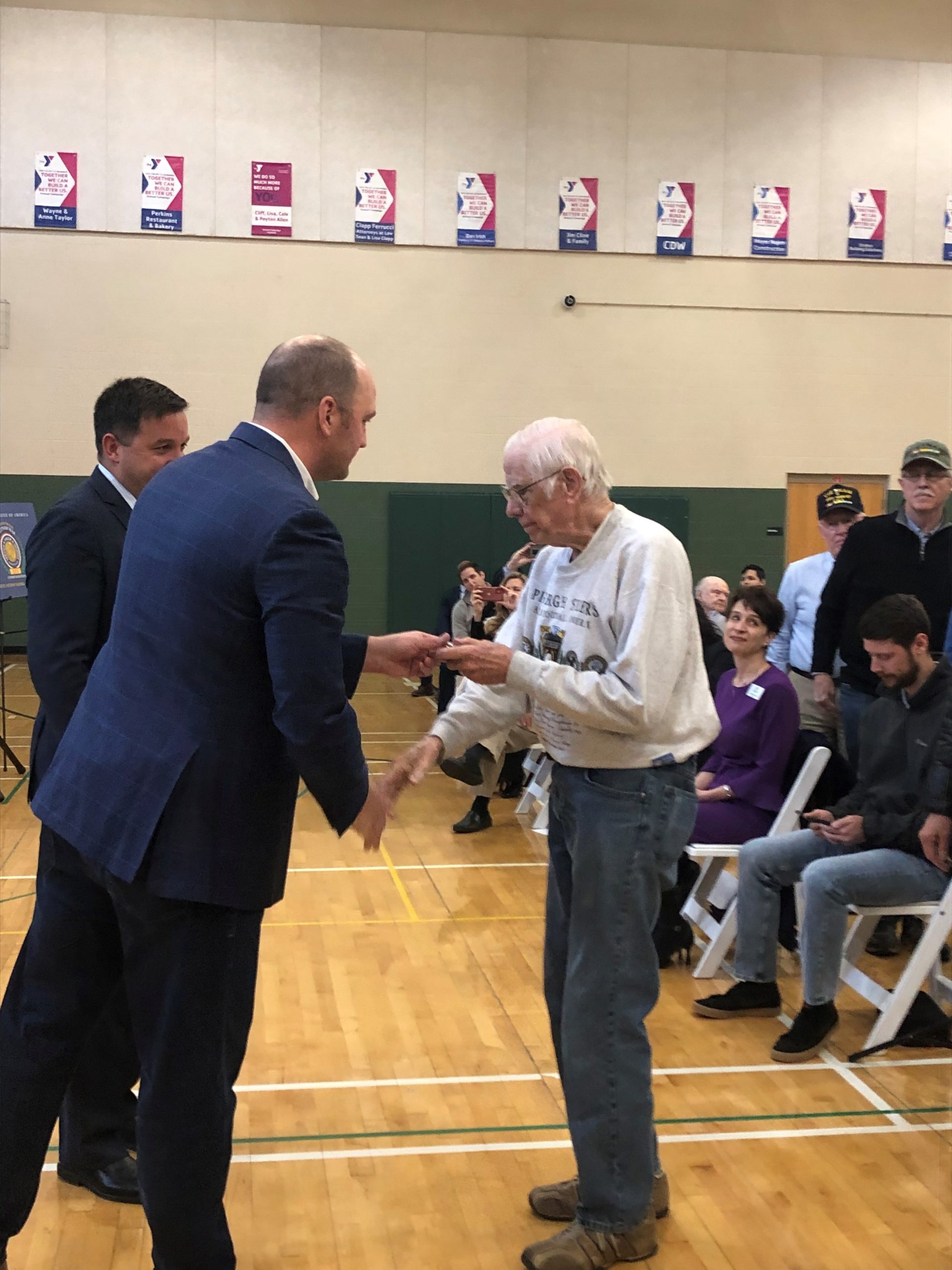 veteran shaking mayor's hand