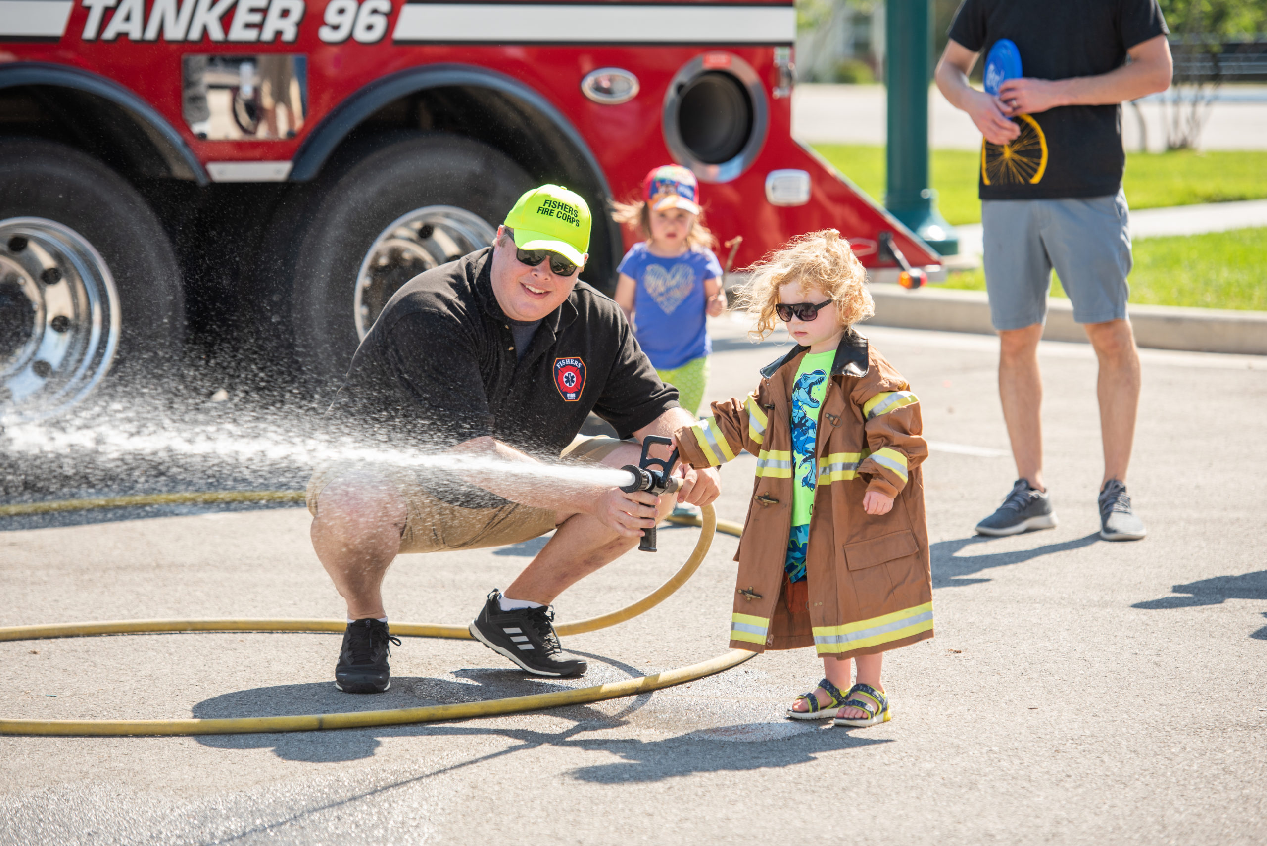 fireman and child with hose
