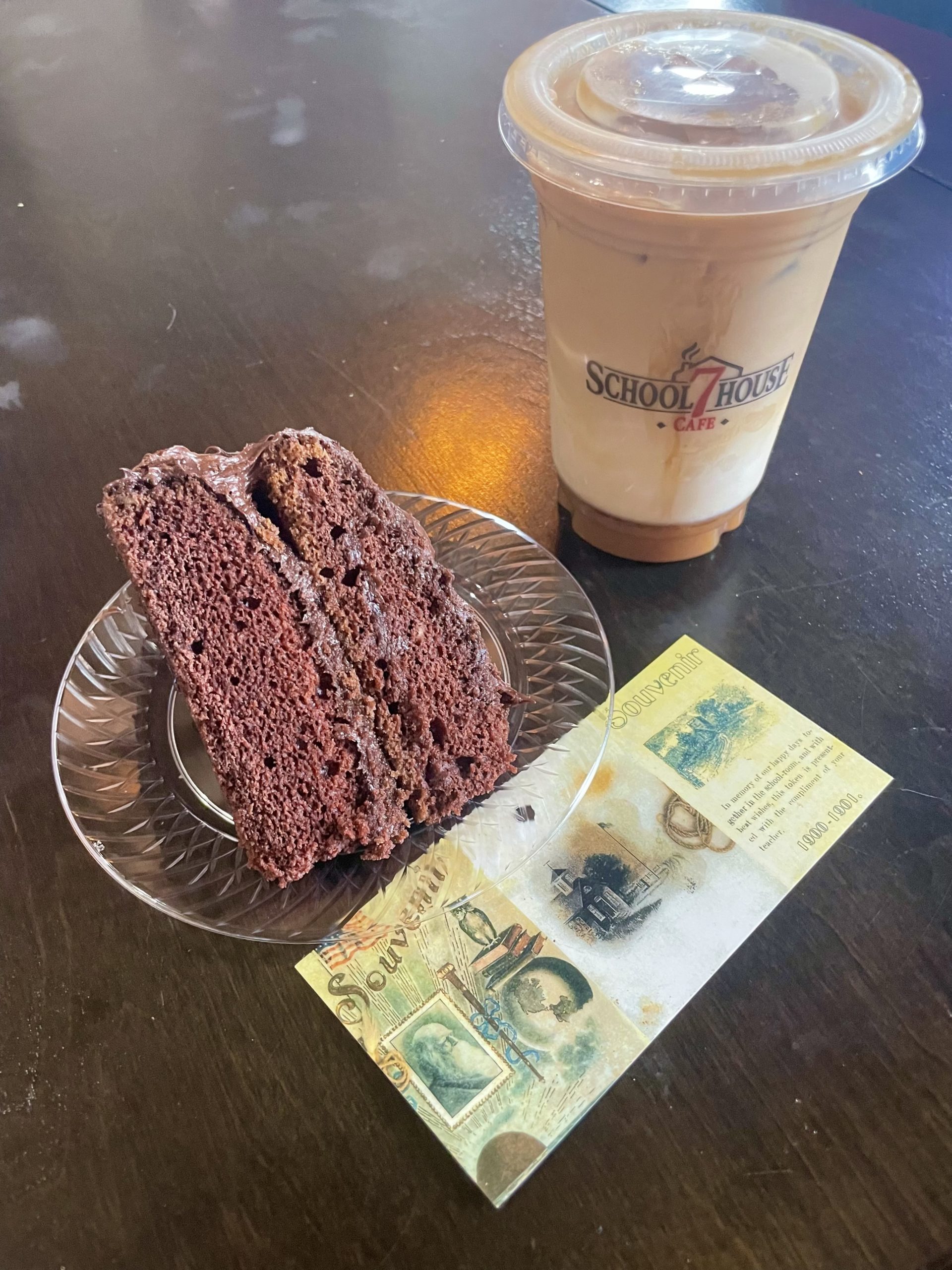 cake, drink, and bookmark on table