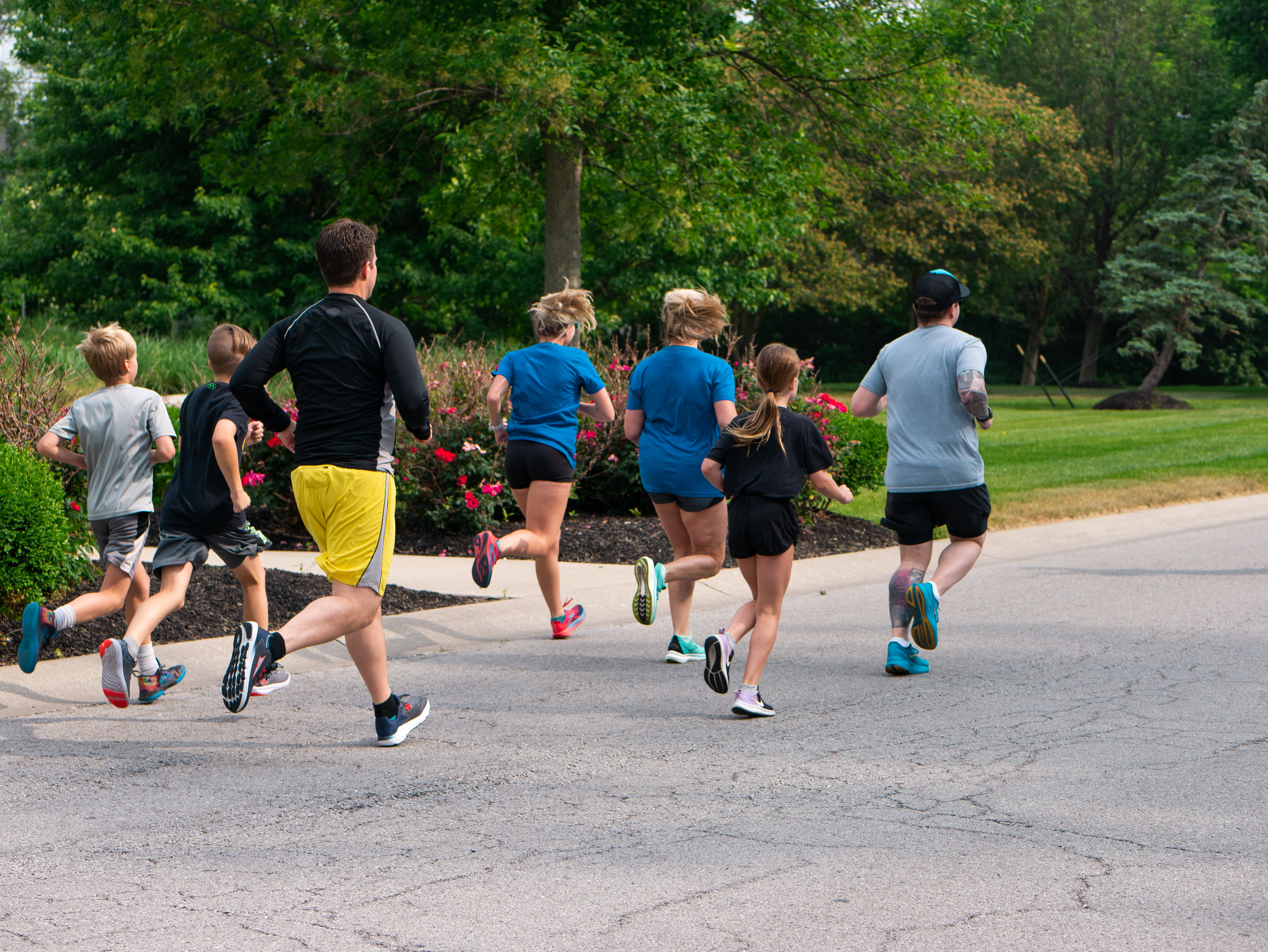 Adults and children running